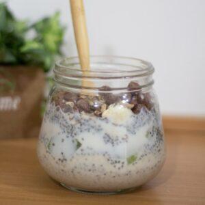 clear glass jar with yogurt and chia seeds