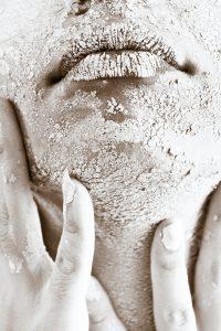 close up of a face with dried paint