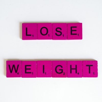 pink letter blocks spelling out 'lose weight'